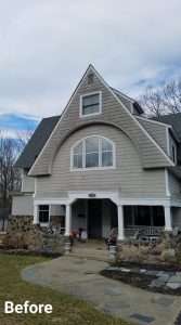 a house with dirty siding before service